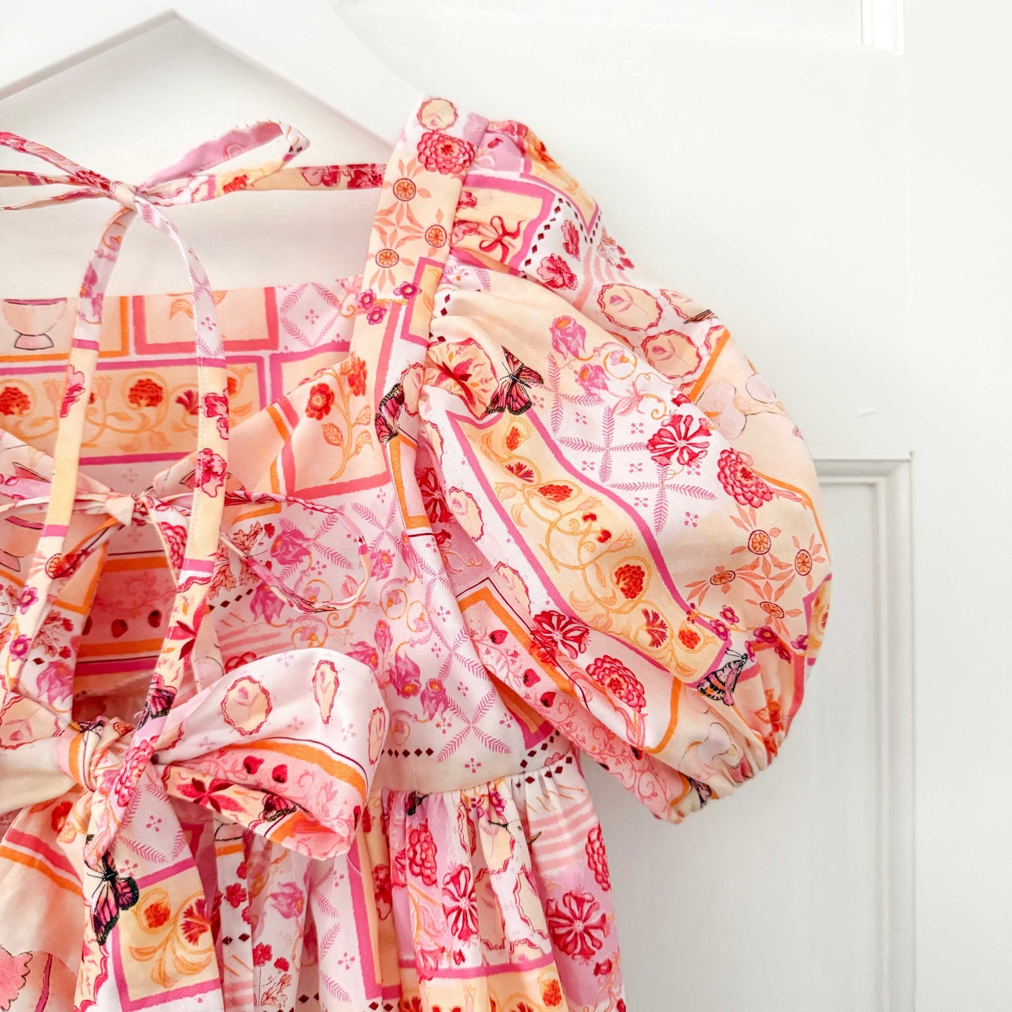 THE LITTLE VILLA ROSA BOW ROMPER